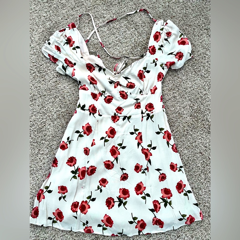 This is a floral summer dress brand new size Medium but fits like a small